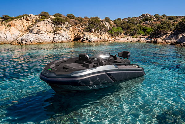 Besnati Hurlo 325 luxury tender powered by the Belassi Marine Power Unit floating in crystal-clear water, showcasing Austrian marine engineering and Italian craftsmanship.